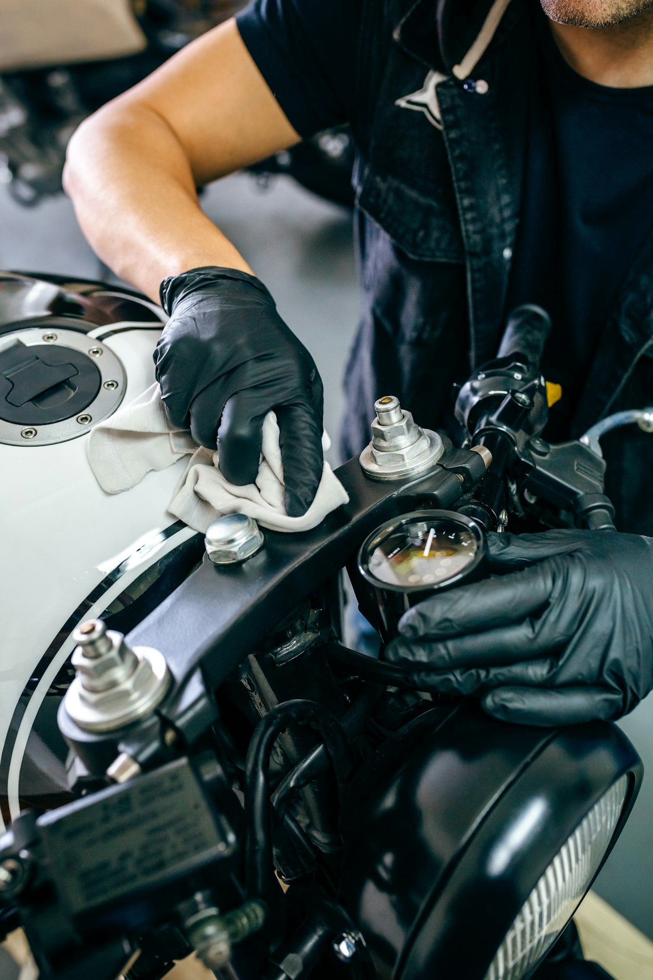 Mechanic cleaning a motorcycle